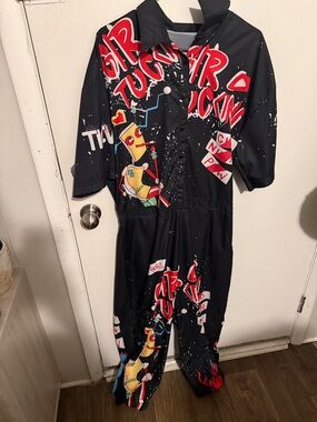 Fashion Nova Black Graphic Jumpsuit with Red & Yellow Accents